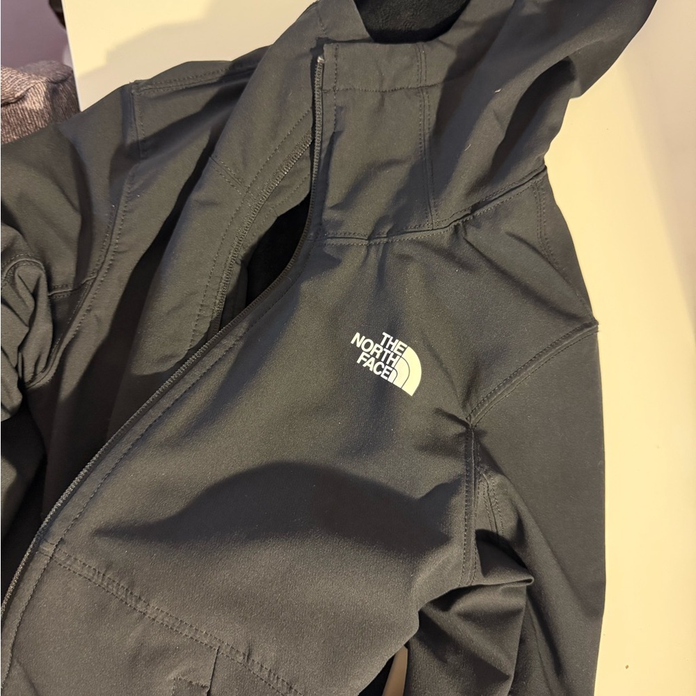 The North Face Black Ski Jacket with Hood and Weather Resistance